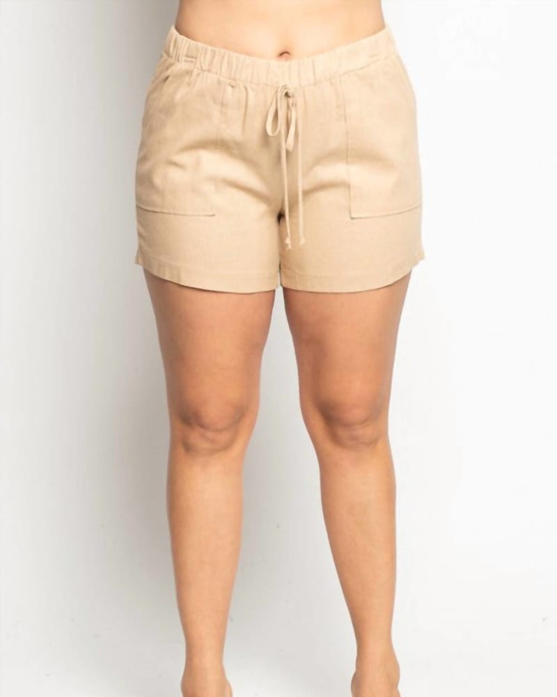 Front of a model wearing a size 2X Linen Shorts- Volume In Natural in Natural by Curve Market. | dia_product_style_image_id:347467